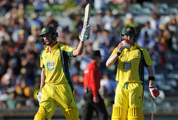 Australia's George Bailey (C) celebrates his century next to captain Steve Smith during the one-day international cricket match between India and Australia in Perth on January 12, 2016.  AFP PHOTO / Greg WOOD --IMAGE RESTRICTED TO EDITORIAL USE  NO COMMERCIAL USE-- / AFP / GREG WOOD        (Photo credit should read GREG WOOD/AFP/Getty Images)