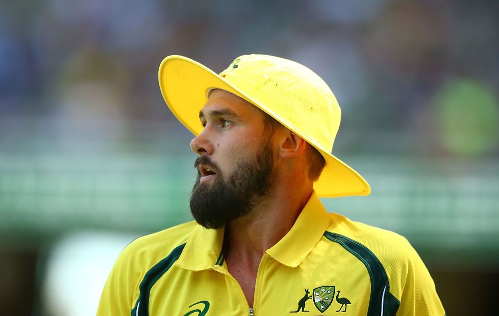 MELBOURNE, AUSTRALIA - JANUARY 17:  Kane Richardson of Australia looks on wearing a yellow floppy hat during game three of the One Day International Series between Australia and India at the Melbourne Cricket Ground on January 17, 2016 in Melbourne, Australia.  (Photo by Scott Barbour/Getty Images)