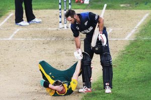 Grant Elliott helps up Dale Steyn during the 2015 Cricket World Cup Semi Final match between New Zealand and South Africa at Eden Park on March 24, 2015 in Auckland, New Zealand.