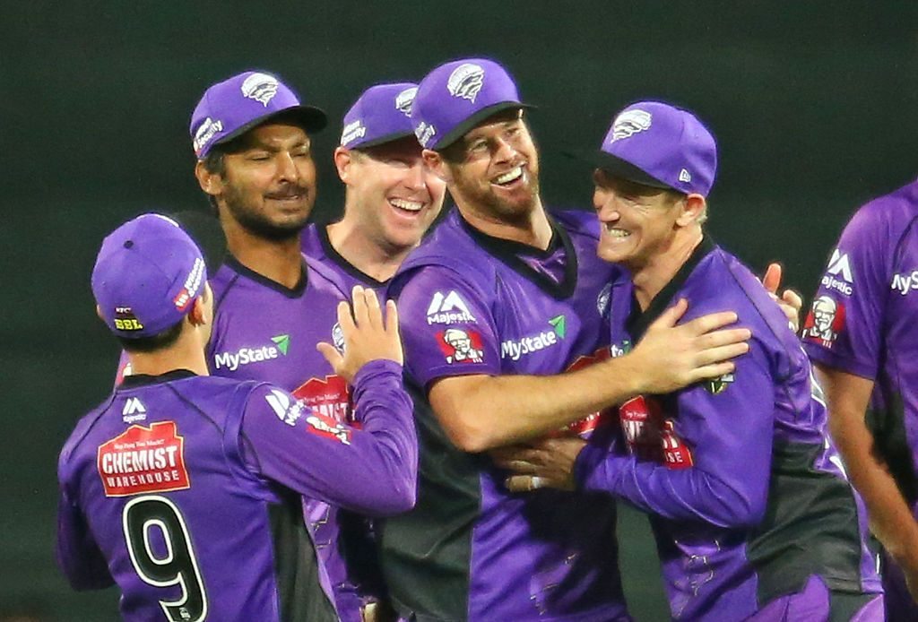 HOBART, AUSTRALIA - JANUARY 01: Dan Christian of the Hurricanes celebrates with Kumar Sangakkara and George Bailey after running out Chris Hartley of the Thunder during the Big Bash League match between the Hobart Hurricanes and the Sydney Thunder at Blundstone Arena on January 1, 2016 in Hobart, Australia. (Photo by Scott Barbour/Getty Images)